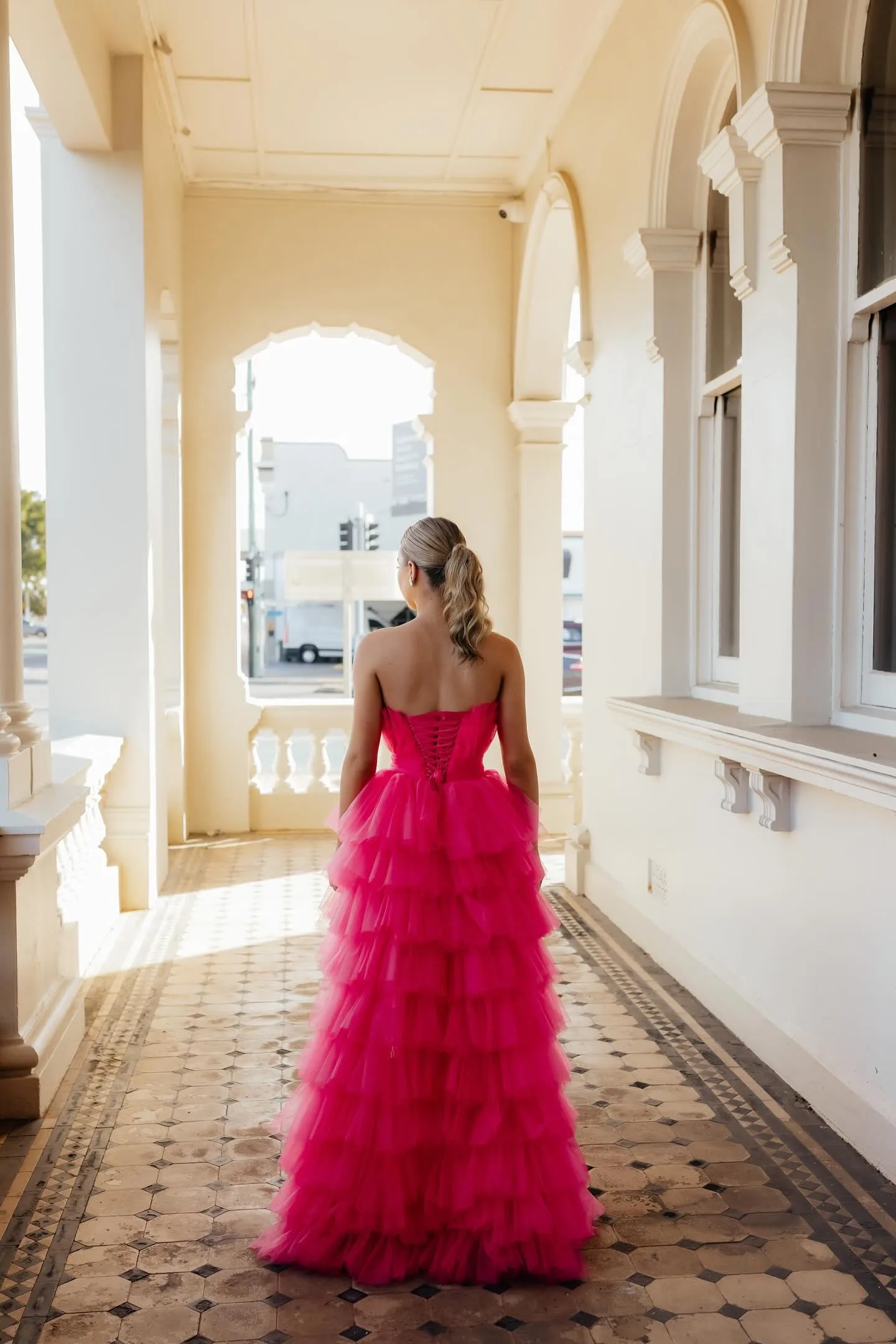 Hot pink hi-low corset tulle-tiered dress